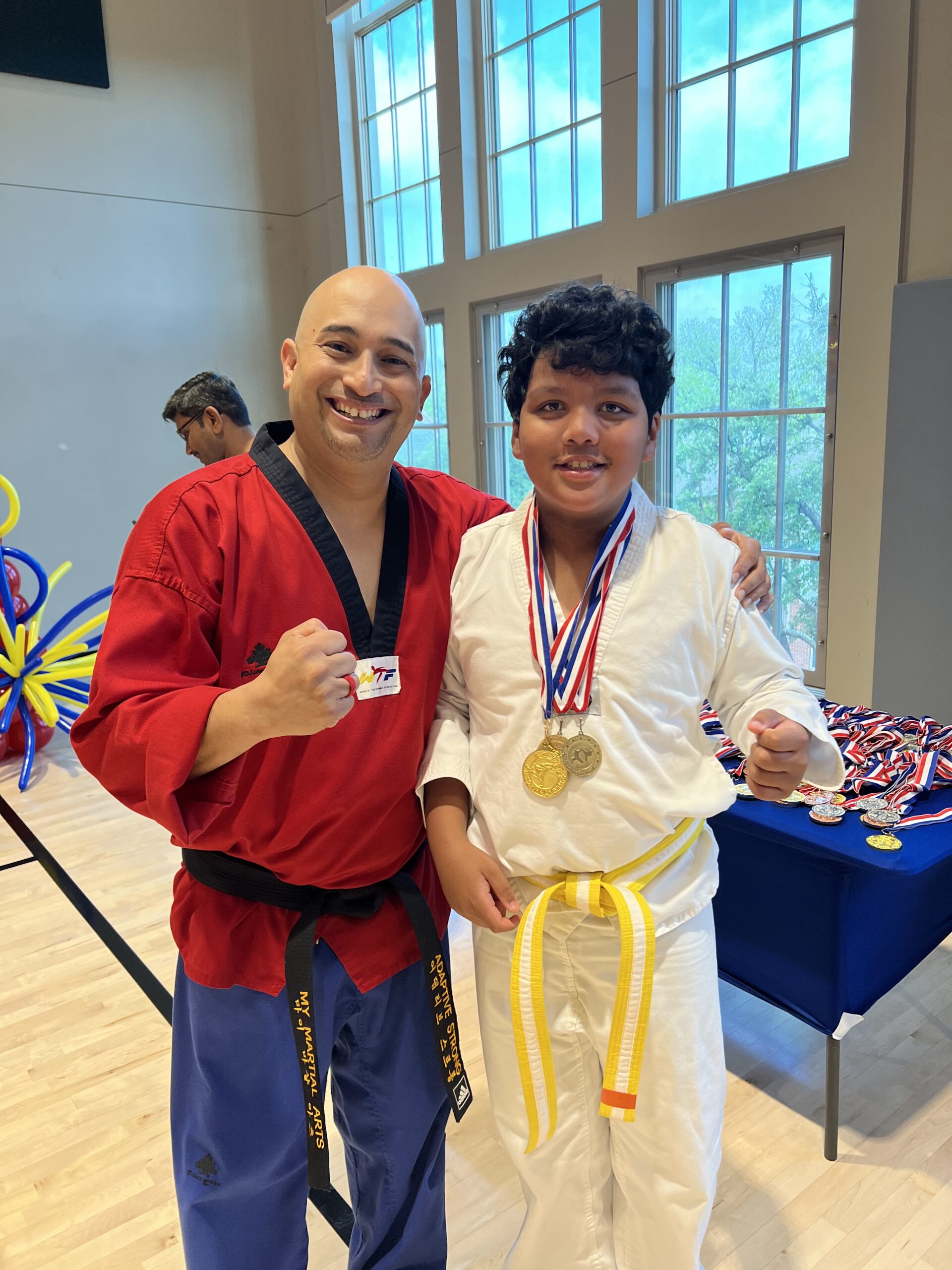 Tony Rios and a student with medals at SNAPMAT